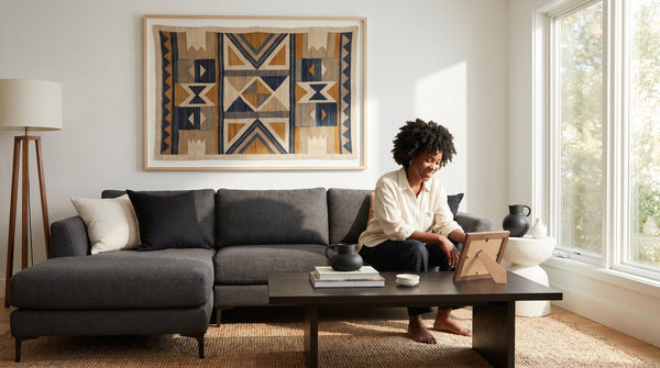 Editorial living room for How to Choose Art That Does Not Look Mass Produced with warm natural light and sophisticated contemporary styling.