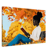 Black woman reading surrounded by fall colors, showcasing stunning African American wall art on canvas.